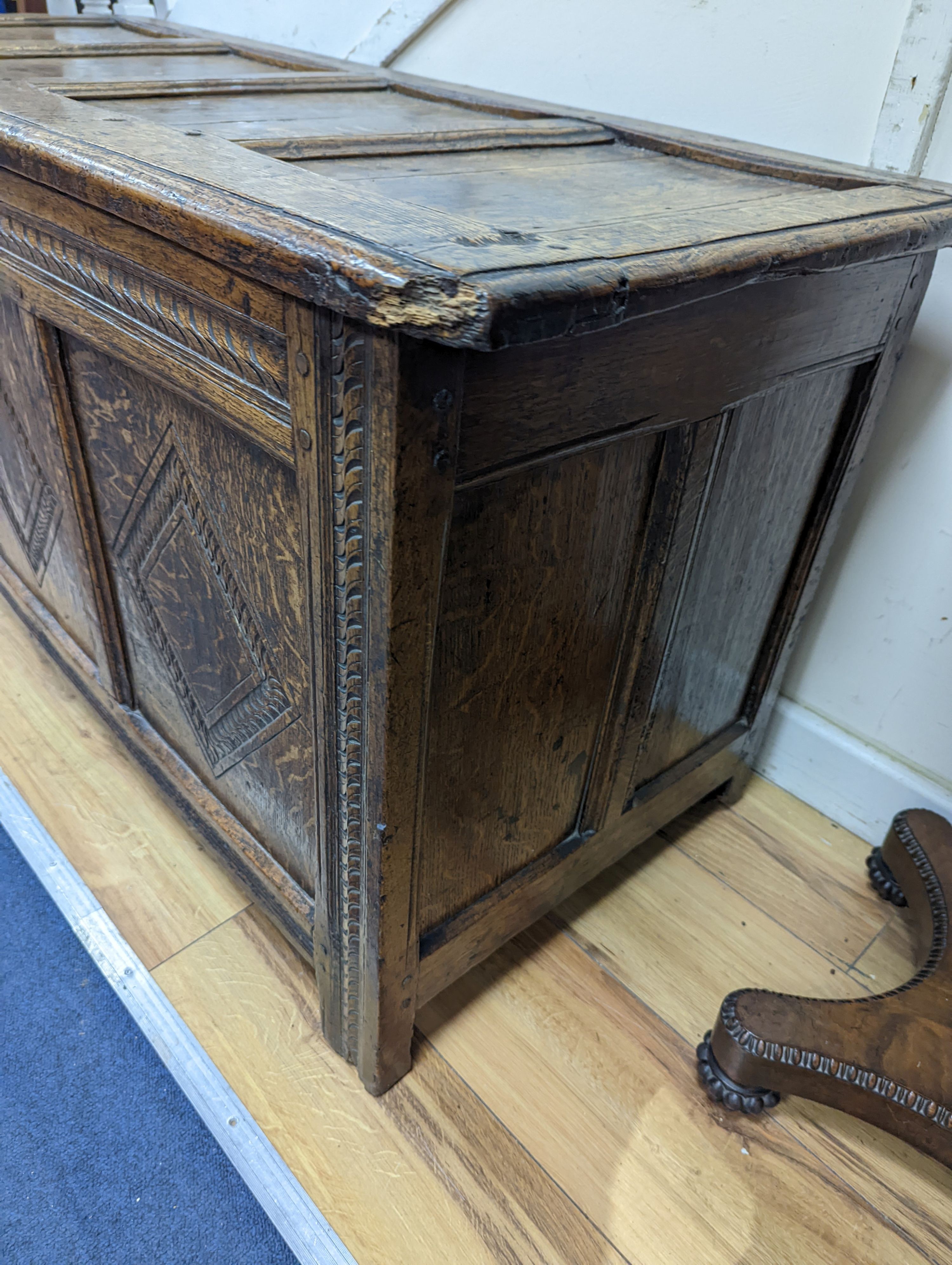 A 17th/18th century panelled oak coffer, length 122cm, depth 50cm, height 62cm